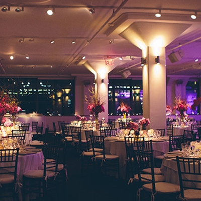 photo: reception decor with red floral centerpieces