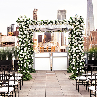photo: rooftop ceremony with white floors overlooking downtown tribeca